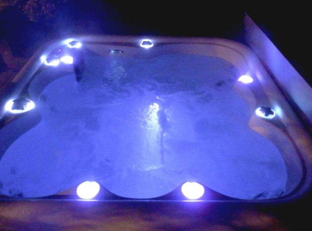 Hot tub at night at Willow Pool House in Kessingland, near Lowestoft, Suffolk