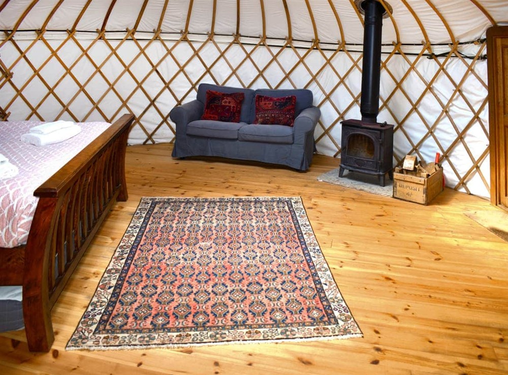 Open plan living space at Willow Yurt in Beaminster, Dorset