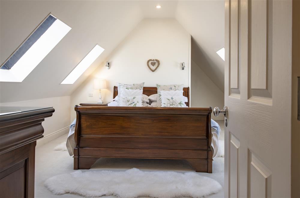 Bedroom two has a beautiful sleigh bed and en-suite bathroom at Willowgarth House, Northallerton, North Yorkshire