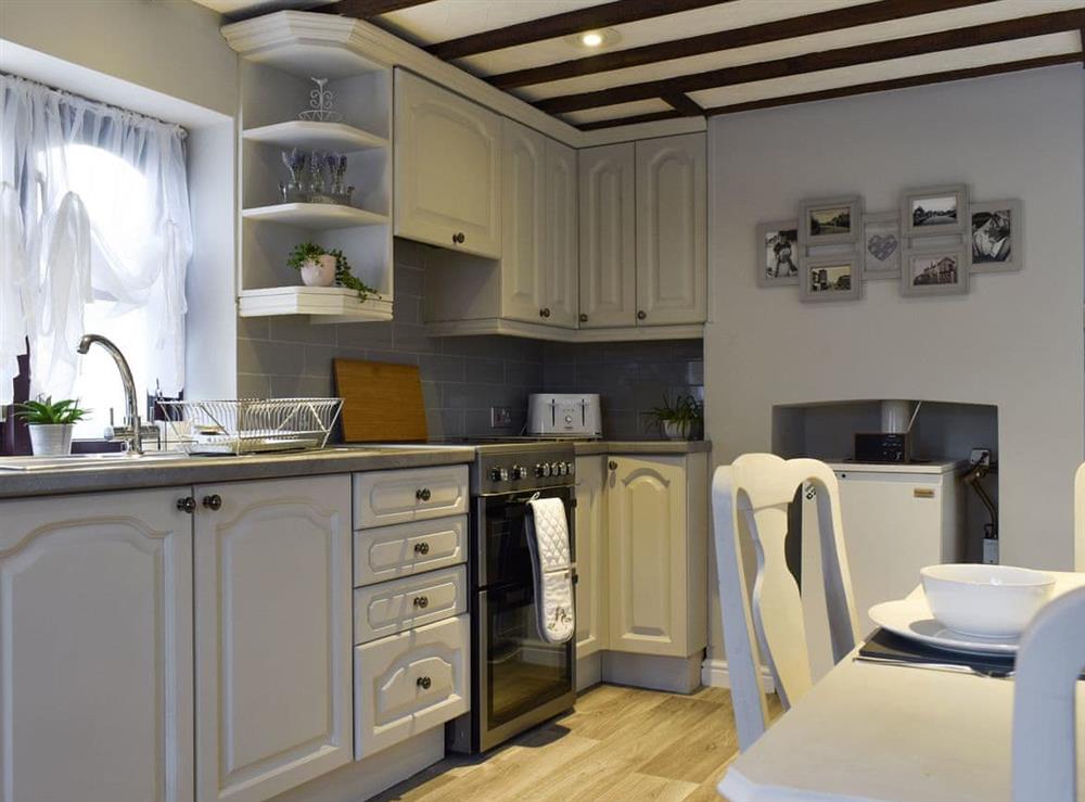 Well-equipped kitchen with dining area at Wilma Cottage in Geldeston, near Beccles, Suffolk