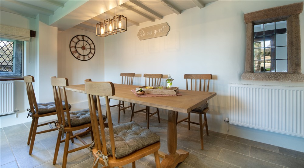 The dining area in the kitchen and dining room at Wilson Farmhouse in Hope Valley, Derbyshire
