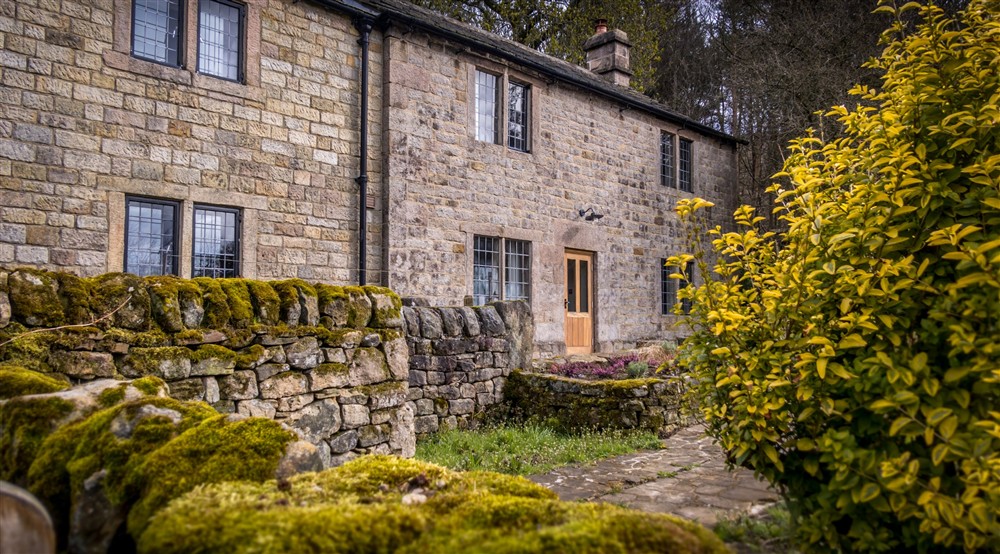 The exterior and garden at Wilson Farmhouse in Hope Valley, Derbyshire