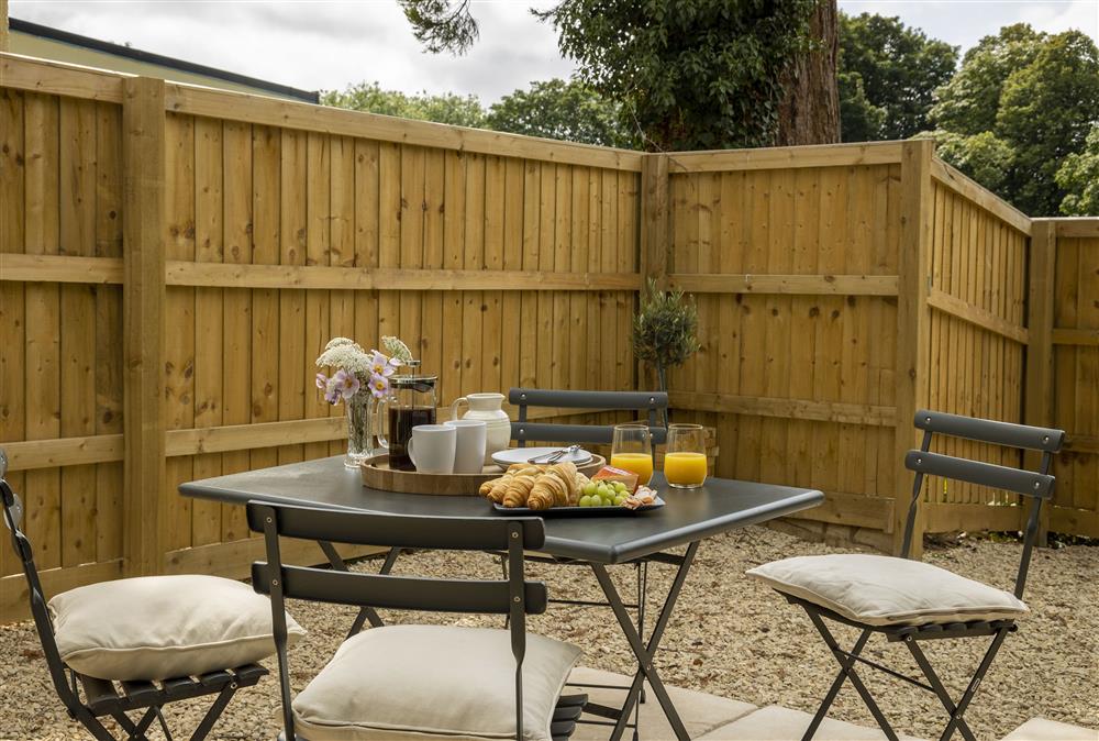 A spot for al fresco dining (barbecue provided) at Winacres Cottage, Box, near Stroud