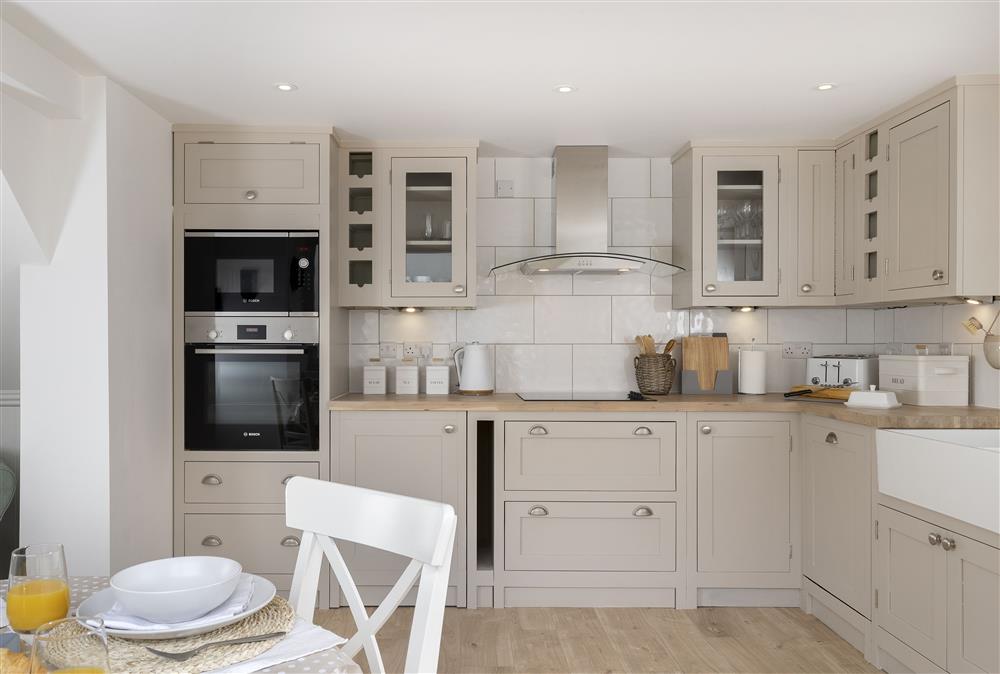 Ground floor: Well-equipped modern kitchen with dining area at Winacres Cottage, Box, near Stroud