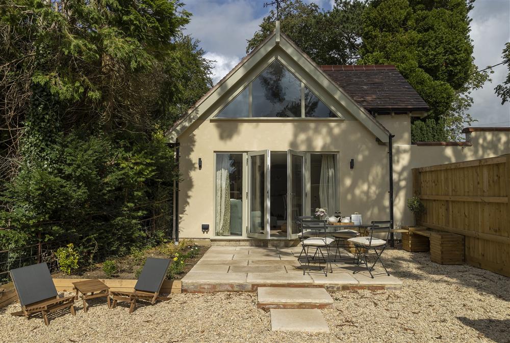 Outside:  Quiet and private outdoor patio, a west facing sun trap garden oasis  at Winacres Cottage, Box, near Stroud