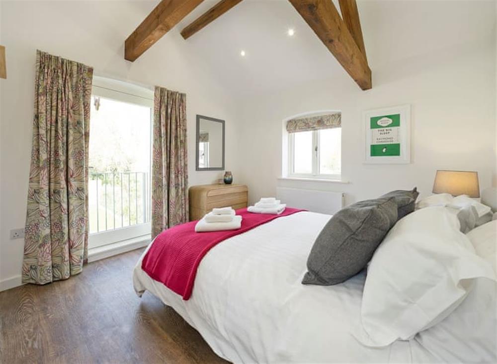Sumptuous double bedroom with beams (photo 2) at The Cart Barn, 