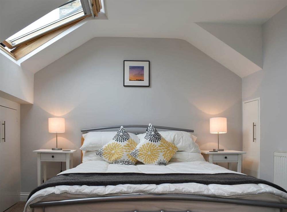 Attic bedroom with double bed at Windy Dales Cottage in Skipton, Yorkshire, North Yorkshire