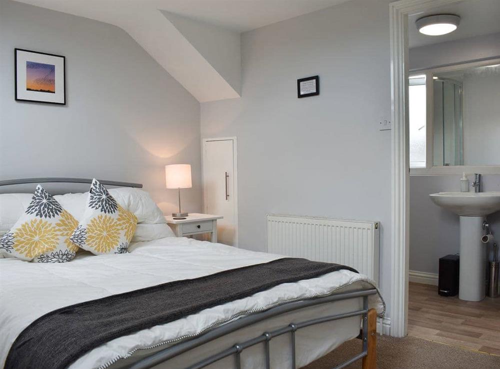 Spacious bedroom with en-suite shower room at Windy Dales Cottage in Skipton, Yorkshire, North Yorkshire