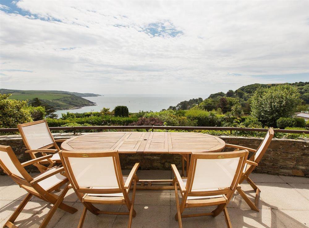 Outdoor eating area with spectacular view at Windy Heath in Salcombe, Devon