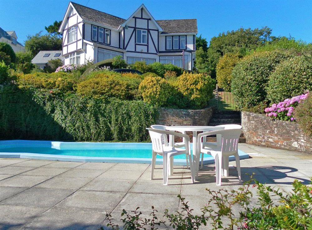 The cottage from the garden (and the pool) at Windy Heath in Salcombe, Devon