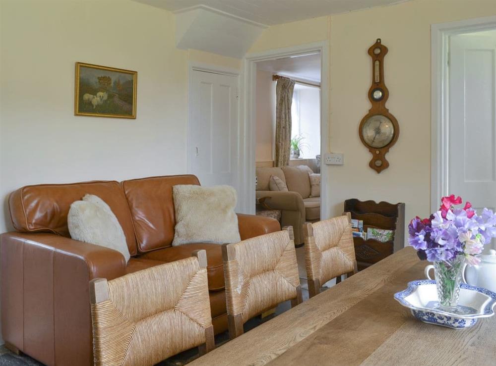 Comfortable seating area within the dining room at Winscott Cottage in Holsworthy, near Bude, Devon