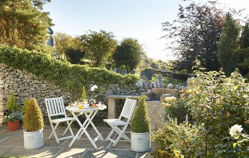 Stylish table and chairs perfect for a spot of sun on the patio at Winsmore Cottage, Over Haddon