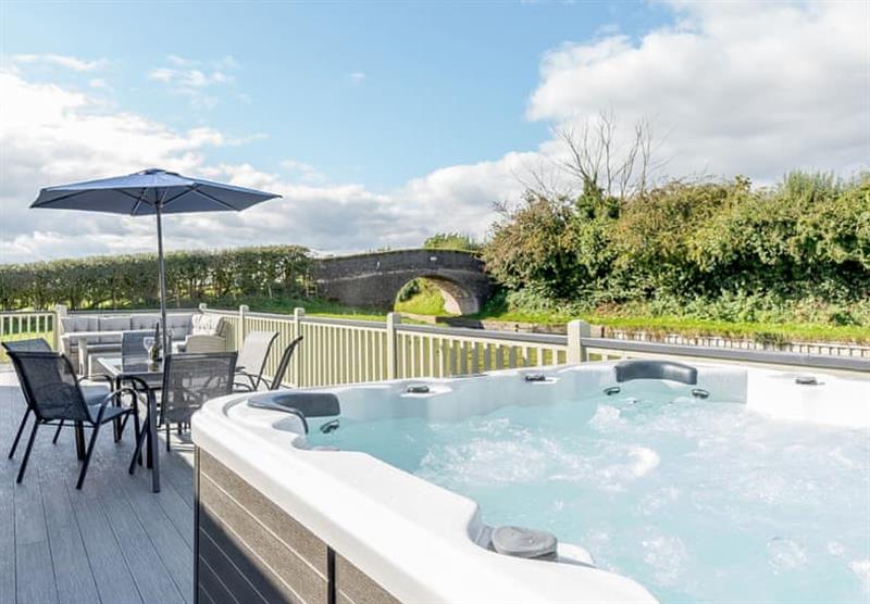 Hot tub on the decked area in the Heron at Winston Farm Lodges in Tetchill, Ellesmere