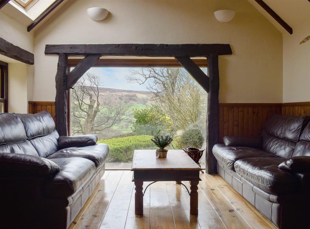 Sitting room with picture window at Winter Gill Barn in Glaisdale Head, North Yorkshire