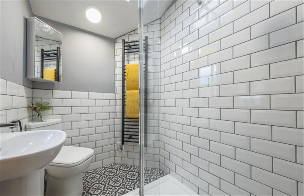 Ground floor: Smart fulled tiled stylish shower room at Wishing Well Cottage, North Creake near Fakenham
