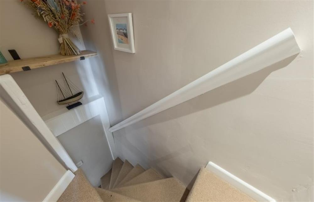 Ground floor: Steep Norfolk winder stairs to the first floor at Wishing Well Cottage, North Creake near Fakenham