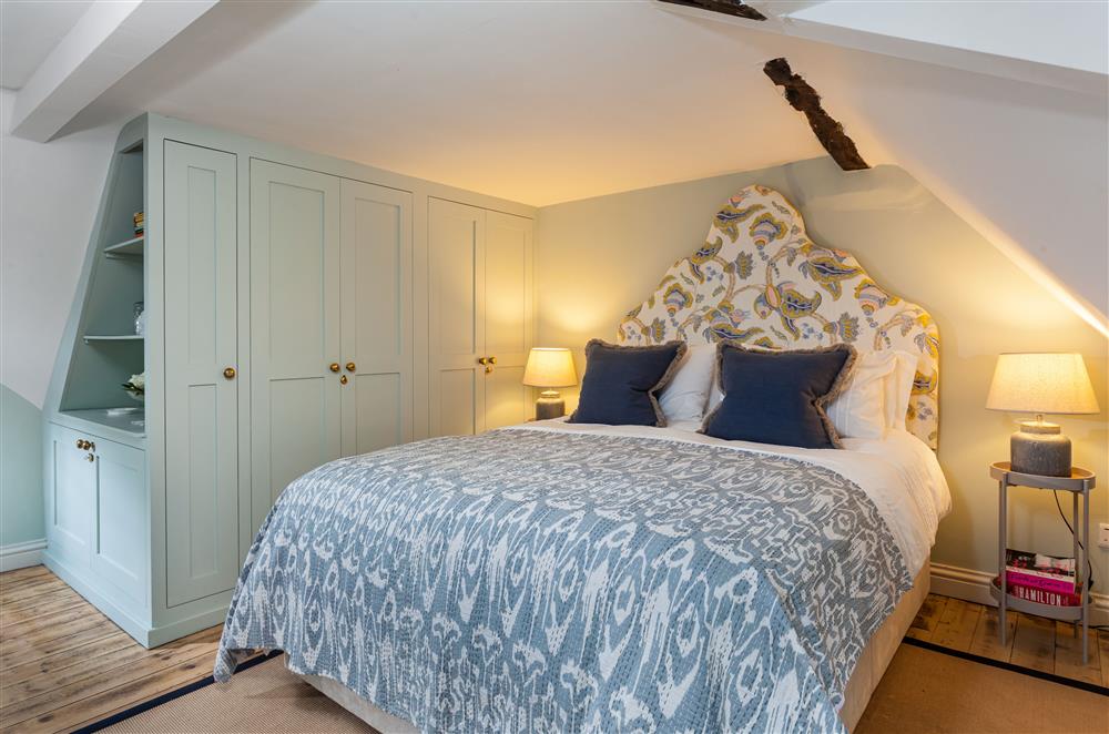 Bedroom one with 5’ king-size bed at Wisteria Cottage, Urchfont, near Devizes