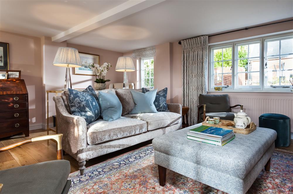 The inviting sitting room enjoys countryside views at Wisteria Cottage, Urchfont, near Devizes