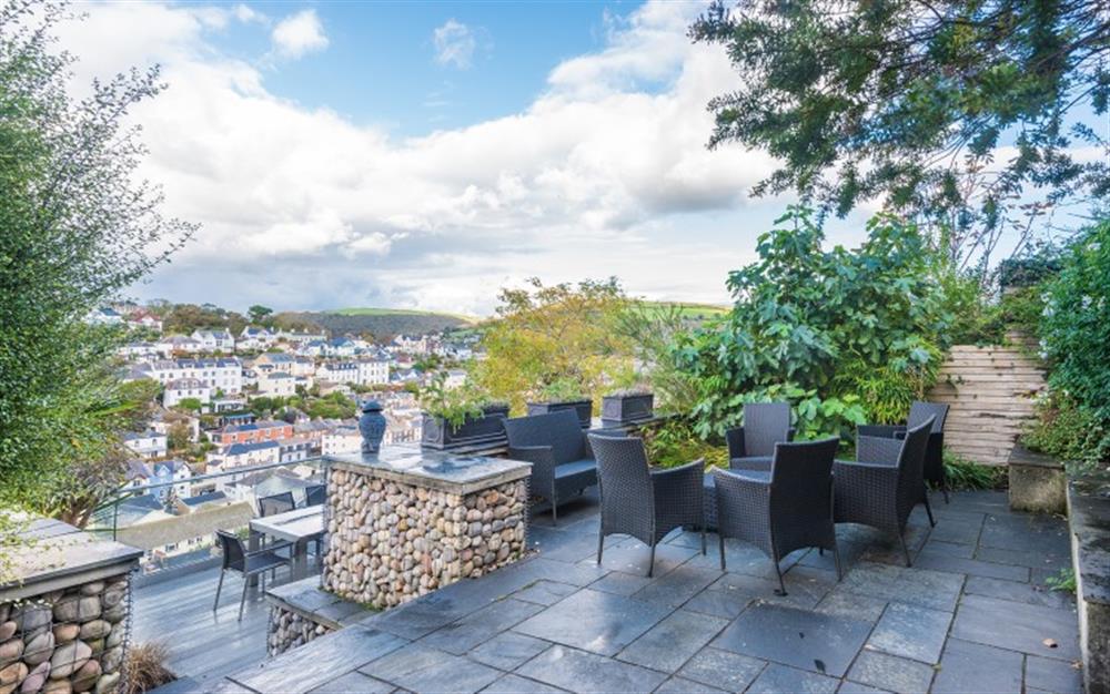 Higher terrace with comfortable seating for 8 and views across town to the river. at Wisteria House in Dartmouth