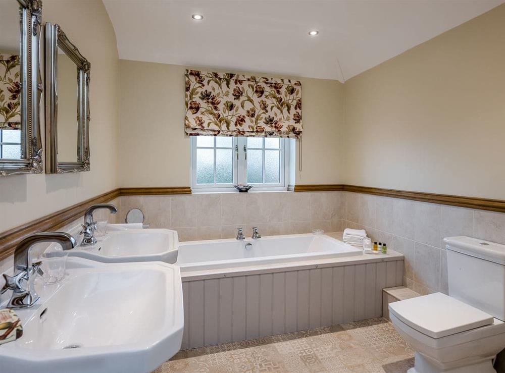 Bathroom with separate double shower at Wisteria House in Henstead, near Southwold, Suffolk