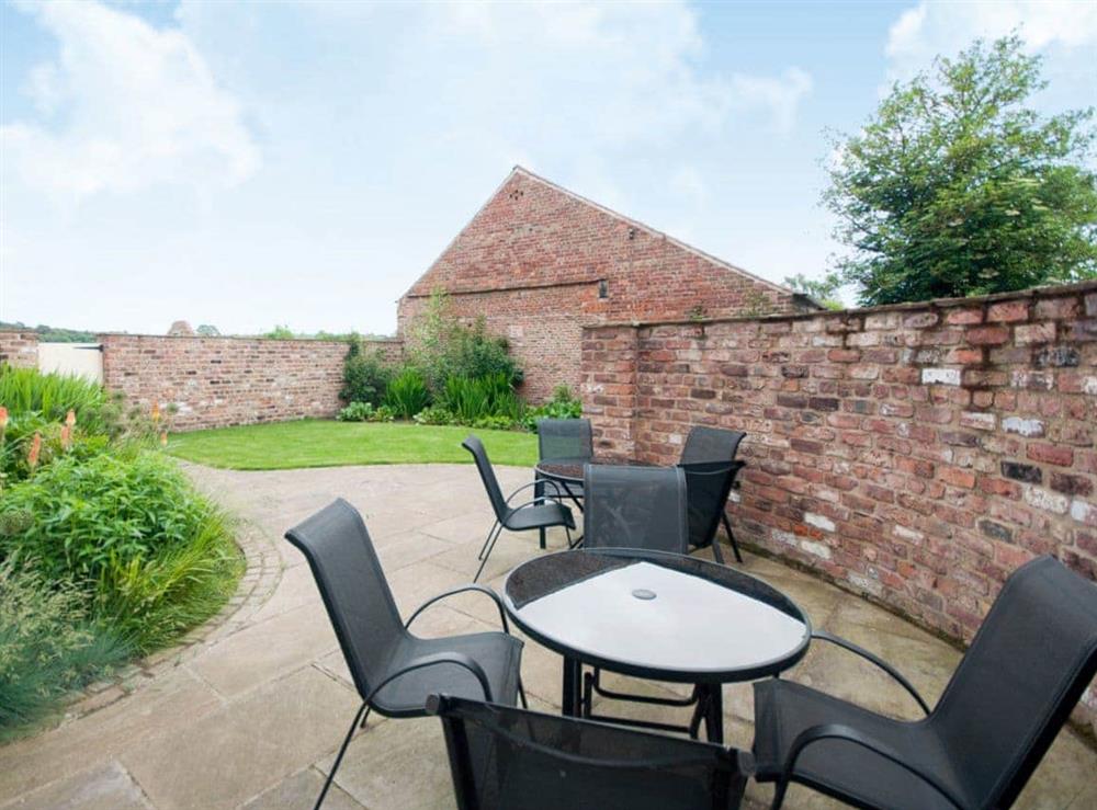 Sitting-out-area at Woldsend Holiday Cottages: Granary Cottage in Rillington, North Yorkshire., Great Britain