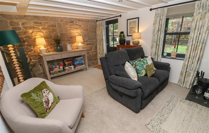 Relax in the living area at Wood Brook Cottage, Crowan