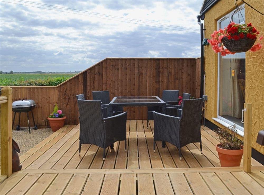 Lovely seating area where an outdoor meal can be enjoyed at Sedge Lodge, 