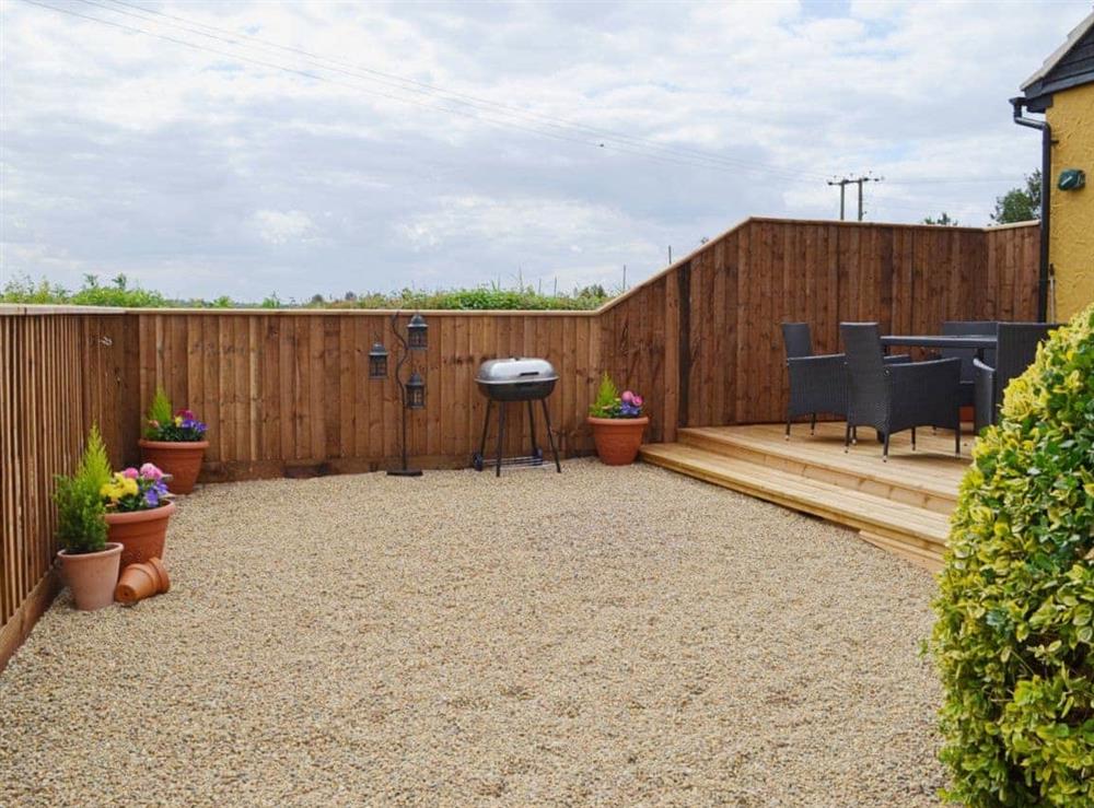 The garden area is laid to gravel at Sedge Lodge, 