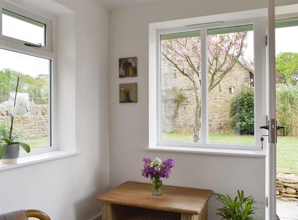 Light and airy porch with garden views at Cherry Cottage, 