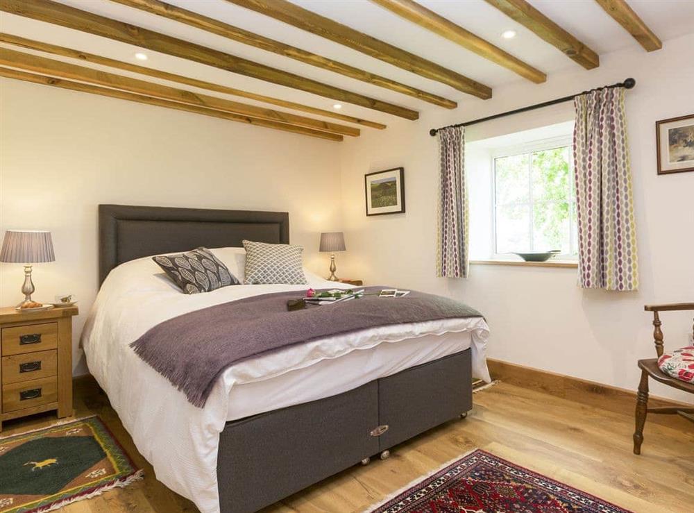 Comfy bedroom with beamed ceiling at The Calf Shed, 