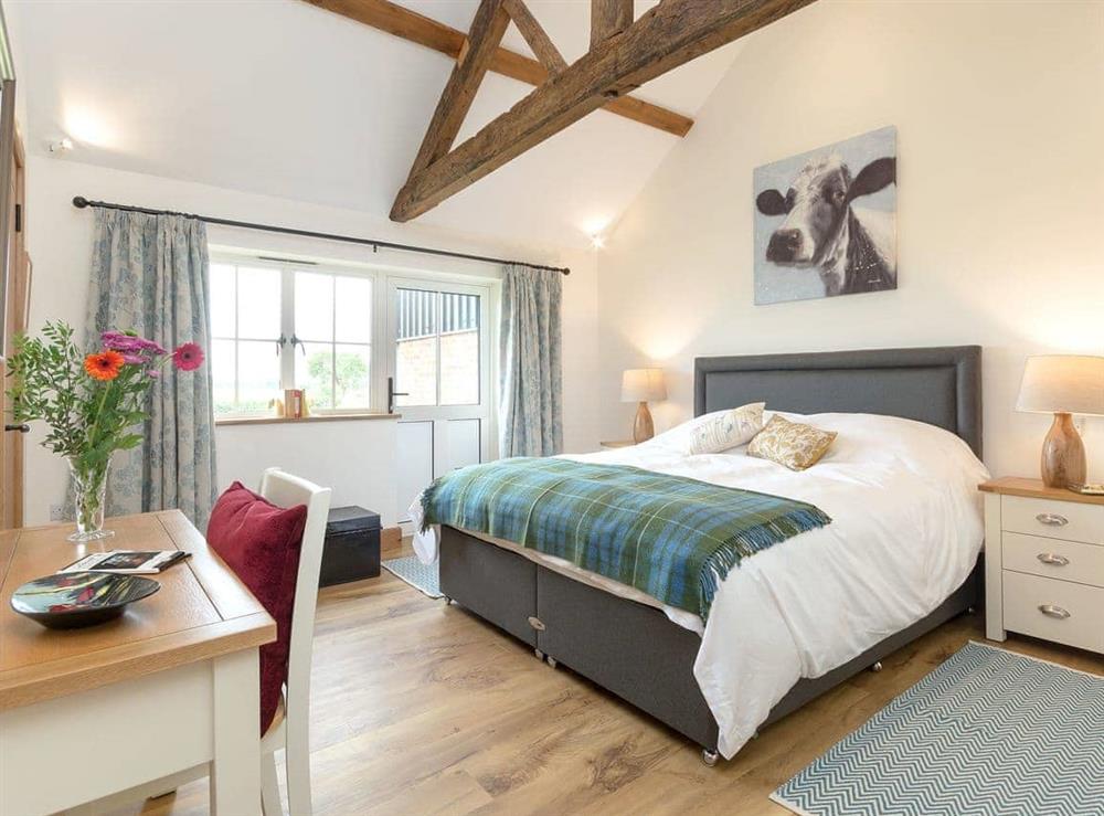 Spacious bedroom with a super kingsize bed at The Old Dairy, 