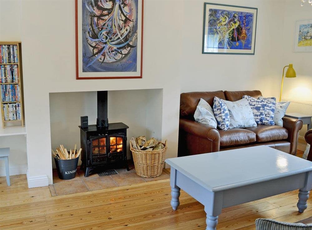 Beautifully decorated living room cosy woodburner (photo 2) at Woodbrook Cottage in Bothenhampton, near Bridport, Dorset