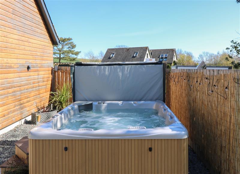 Relax in the hot tub at Woodend Croft, Pitmedden
