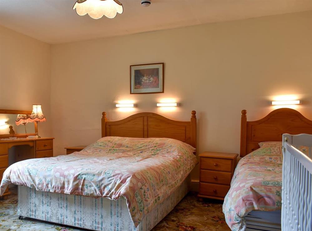Spacious double bedroom with additional single bed at Hameldown, 