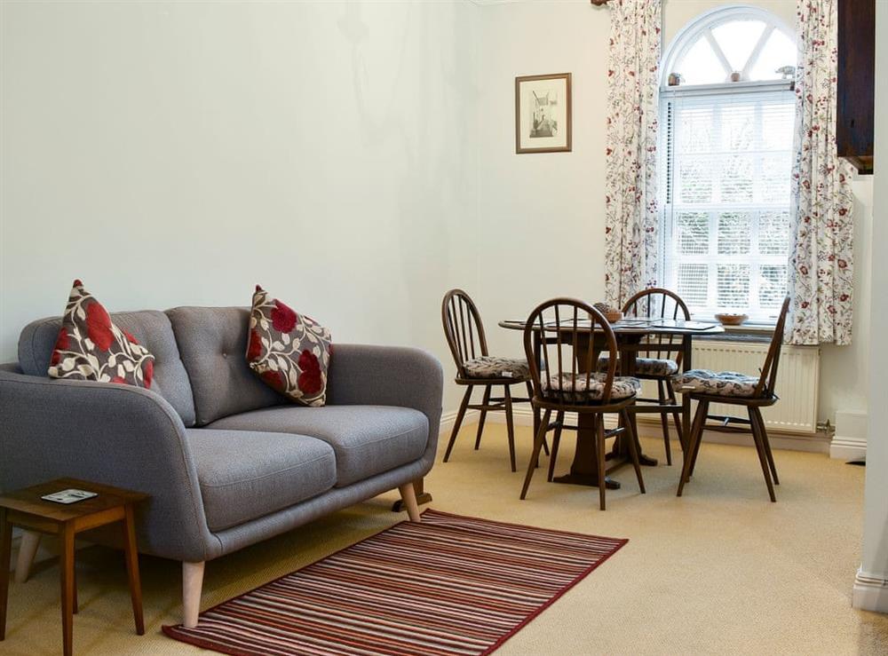 Cosy living/dining room (photo 2) at Woodford House in Bognor Regis, West Sussex