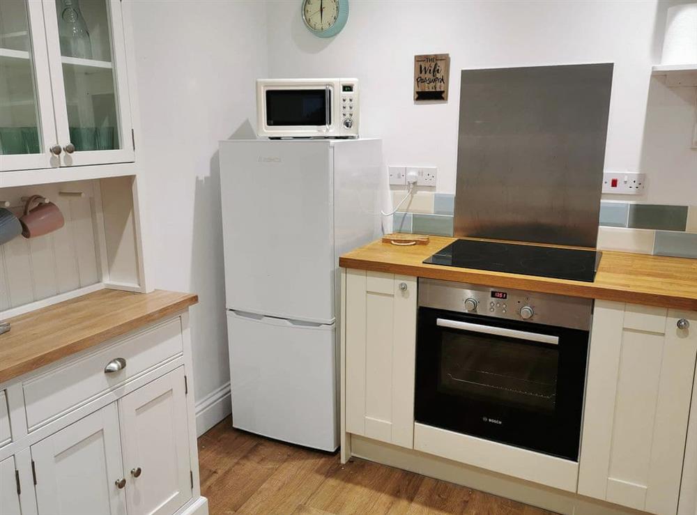 Compact kitchen area at Woodfordes in Sheringham, Norfolk