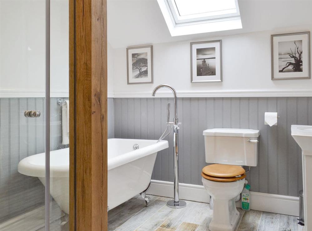 Attractive bathroom with free-standing bath and separate shower cubicle at Woodhouse View in Frodsham, Cheshire