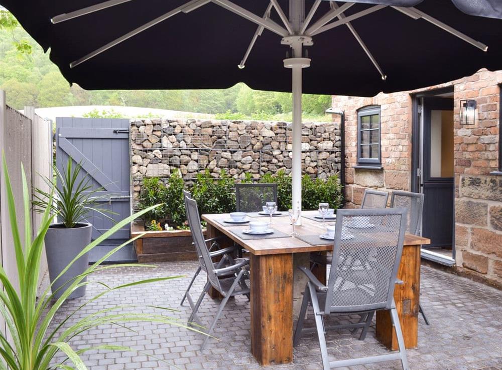 Courtyard with outdoor furniture at Woodhouse View in Frodsham, Cheshire
