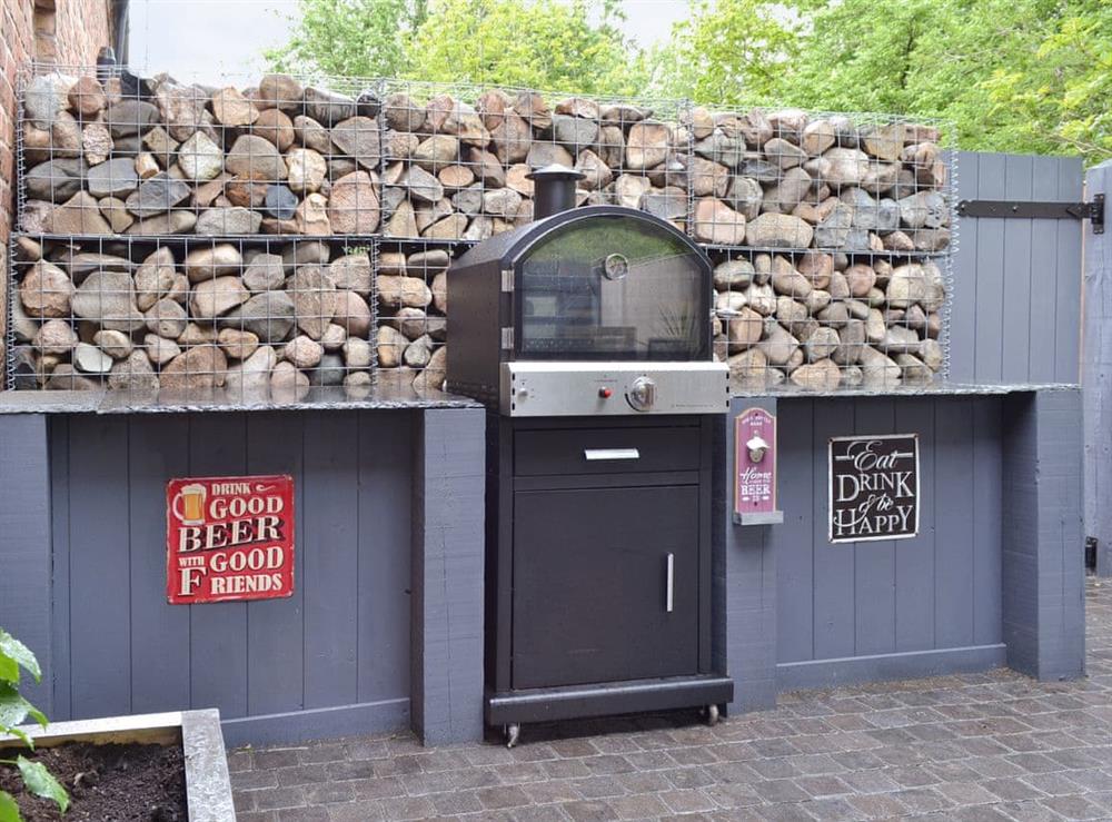 High quality BBQ area within the enclosed courtyard at Woodhouse View in Frodsham, Cheshire