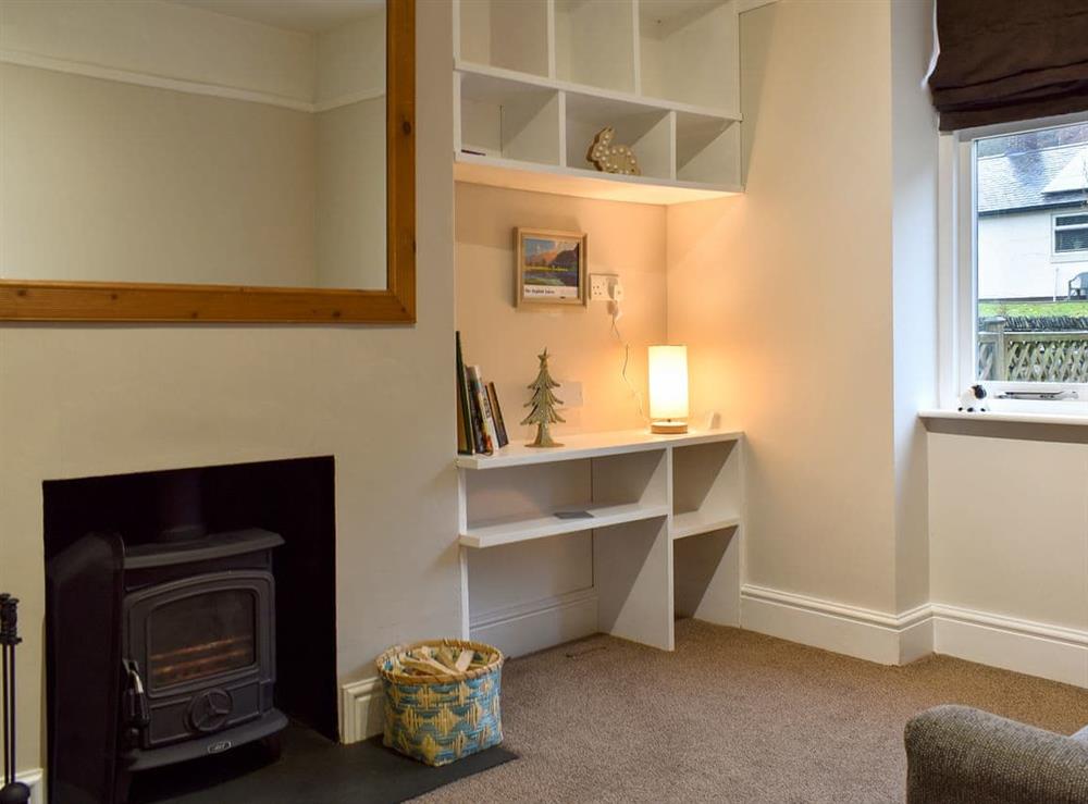 Cosy sitting room with multi-fuel burner at Woodland Cottage in Backbarrow, near Ulverston, Cumbria