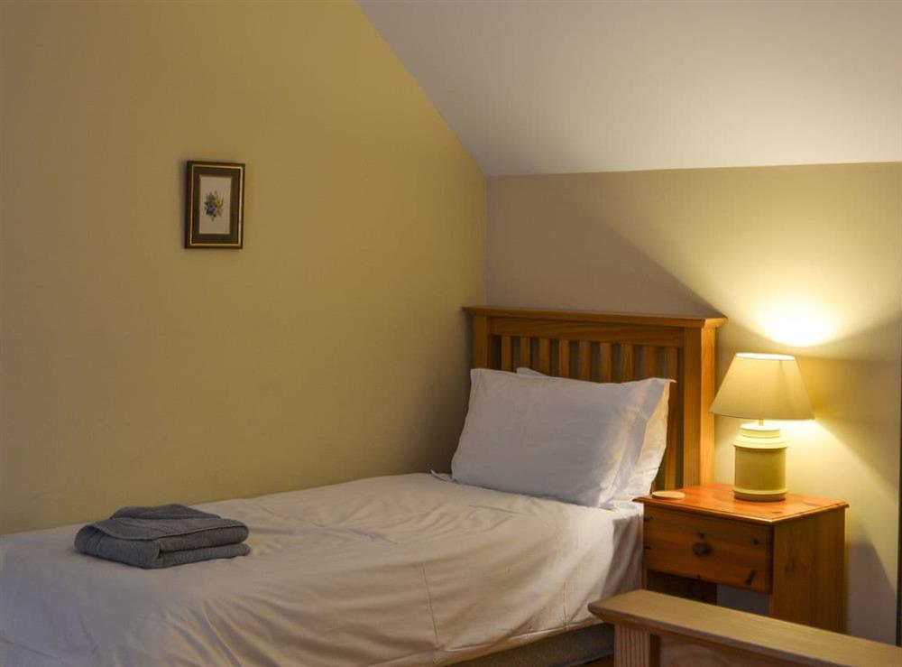 Double bedroom with additional bed at Woodland Lodge in Boat of Garten, near Aviemore, Inverness-Shire