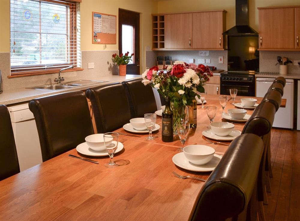 Kitchen and dining area at Woodland Lodge in Boat of Garten, near Aviemore, Inverness-Shire