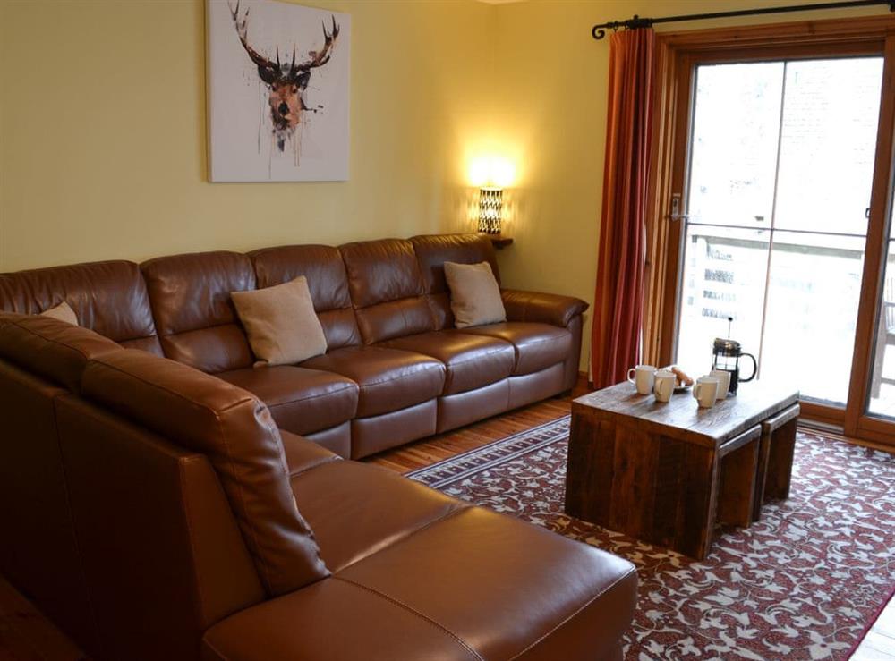 Living room at Woodland Lodge in Boat of Garten, near Aviemore, Inverness-Shire