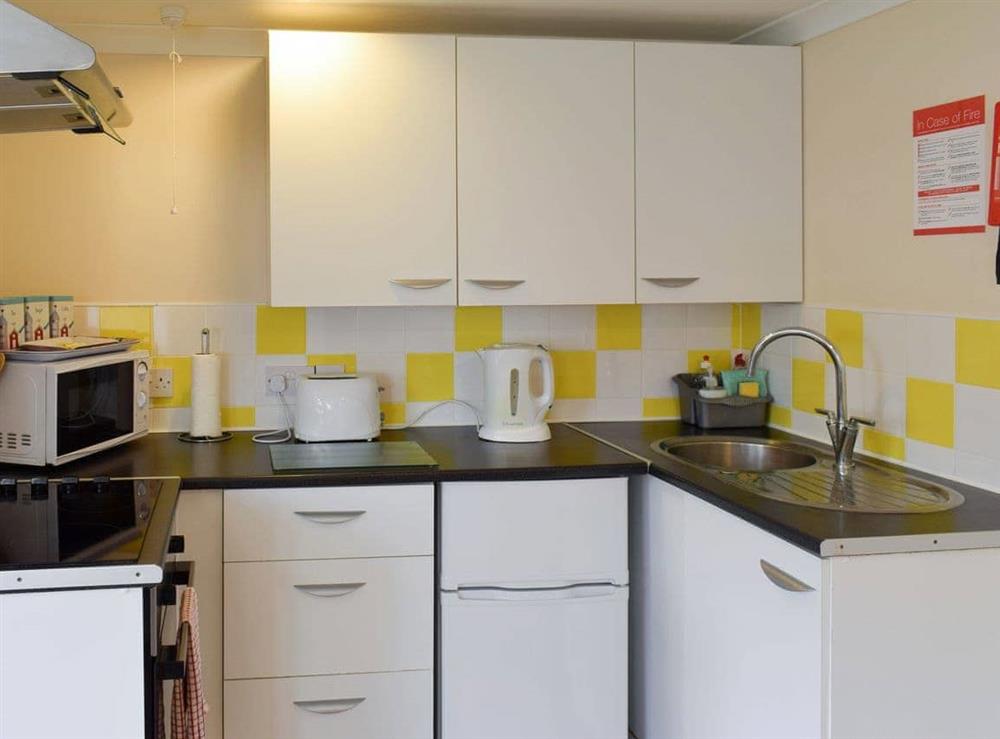 Well-equipped fitted kitchen at Woodland Lodge in Rustington, near Littlehampton, West Sussex