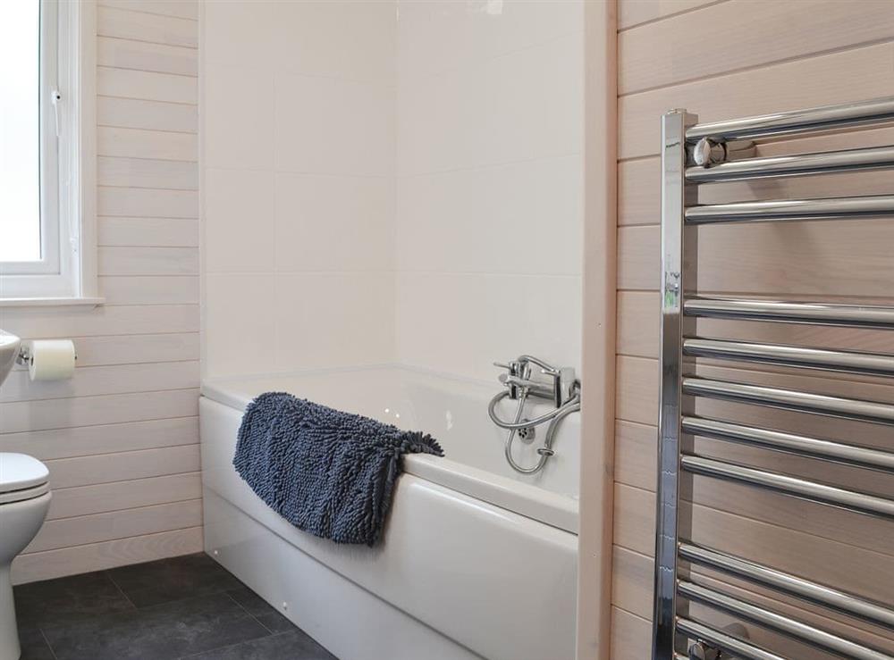 Bathroom with telephone style shower attachment on the bath at Ben Wyvis, 