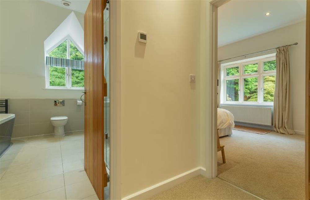 First floor: Bathroom leading to bedroom two at Woodland Pytchley, West Runton near Cromer