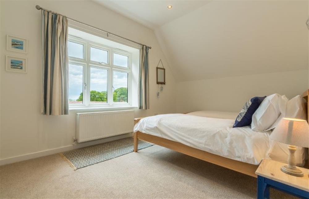 First floor: Bedroom three offers views towards to sea in the far distance at Woodland Pytchley, West Runton near Cromer