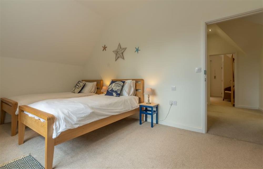 First floor: Bedroom three with full-size twin beds at Woodland Pytchley, West Runton near Cromer