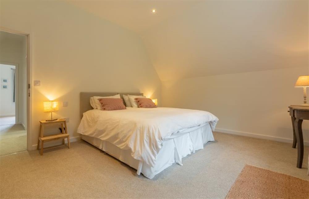 First floor: Bedroom two with super king size zip-and-link bed at Woodland Pytchley, West Runton near Cromer