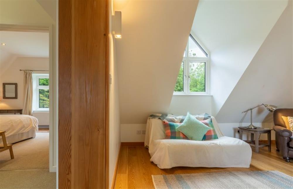 First floor: Galleried seating area leads to bedroom two at Woodland Pytchley, West Runton near Cromer